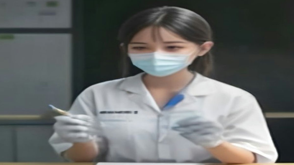FDA approves new immunotherapy for advanced rectal cancer **Medical lab technician holding vial**.