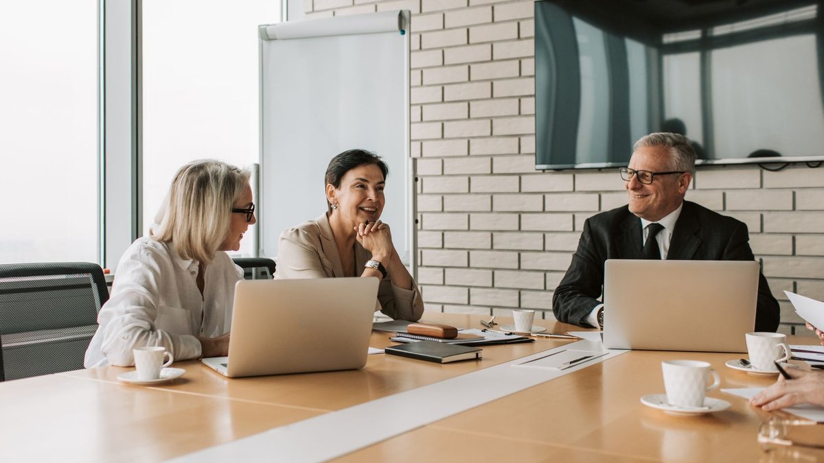 BDR Pharmaceuticals names HR veteran Niral Bhatt as new CHRO Business professionals engaging in a productive meeting in a modern office environment.