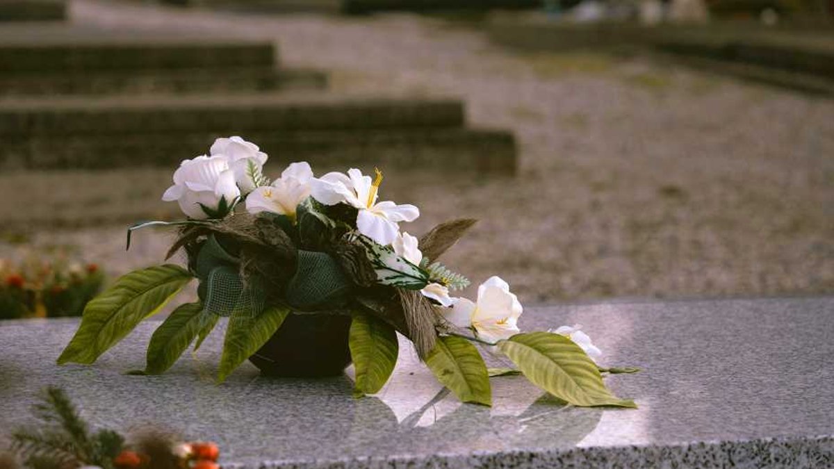 Planning digital estate can ease loved ones burden White flowers on a grave.