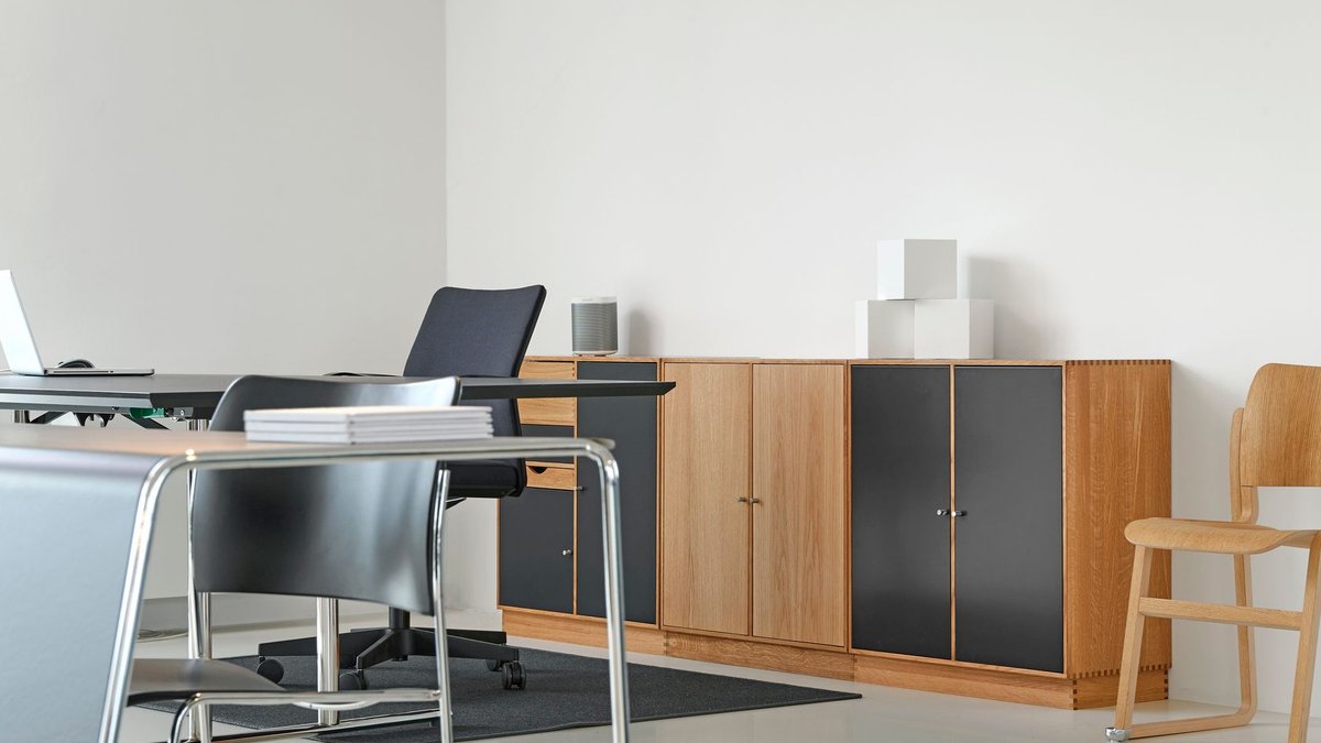 Office design awards honor sustainability and innovation A clean and organized modern office space with stylish furniture and decor.