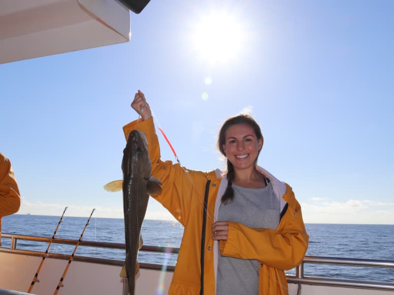 Tourist on sea angling tour