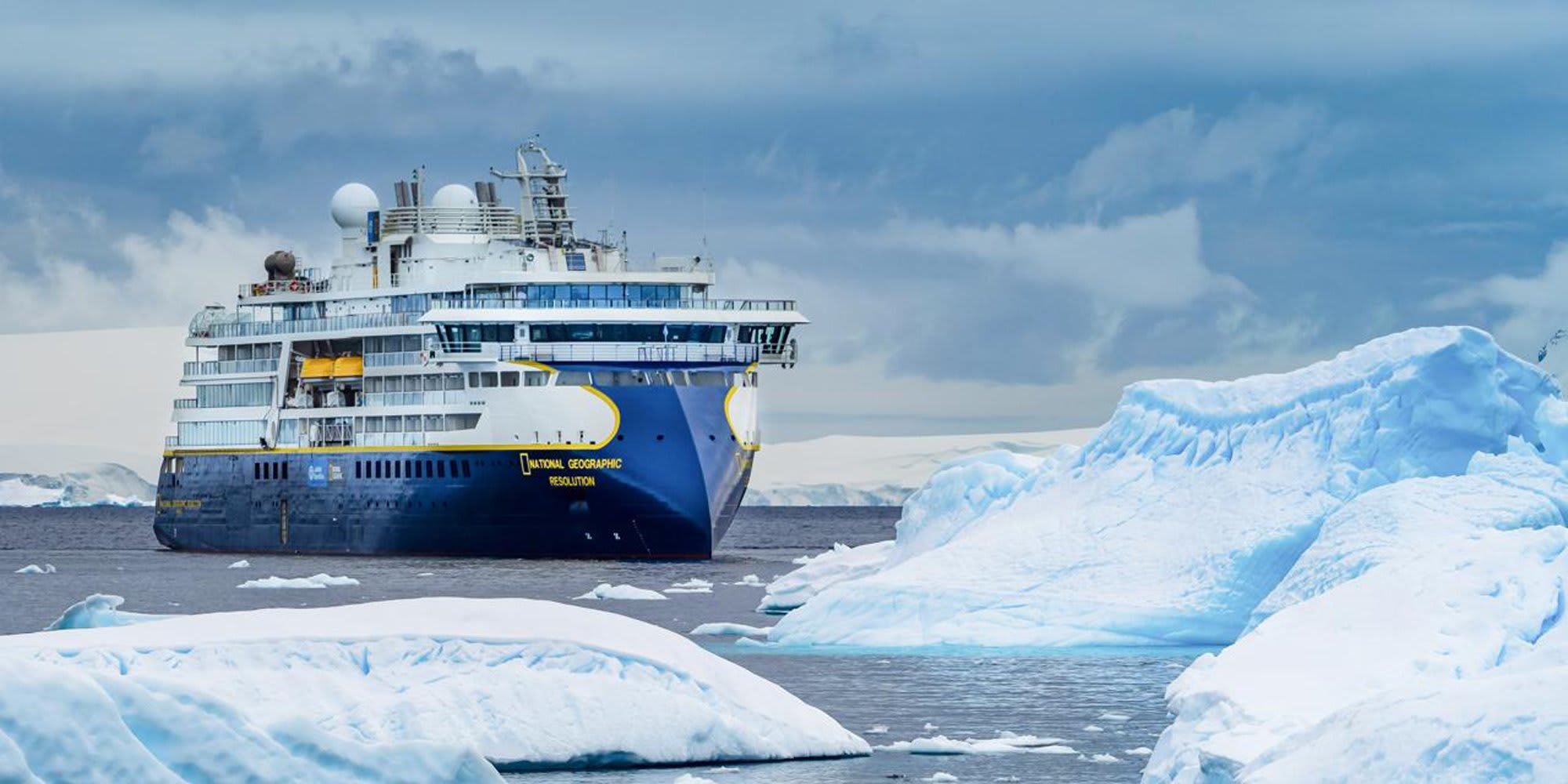 The National Geographic Resolution expedition cruise ship navigates through icy Antarctic waters