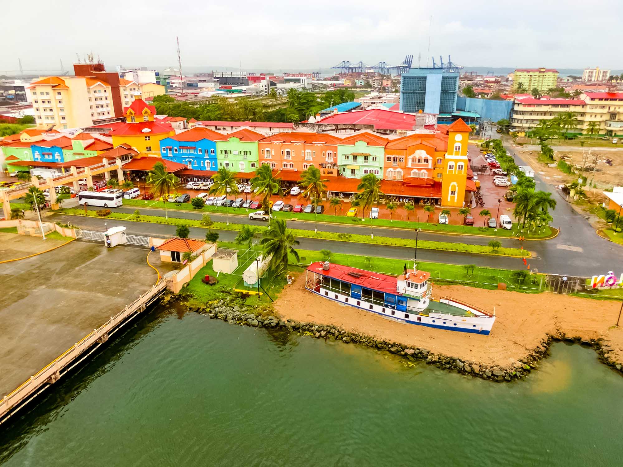A vibrant aerial view of Colón's iconic colorful architecture along the Caribbean waterfront