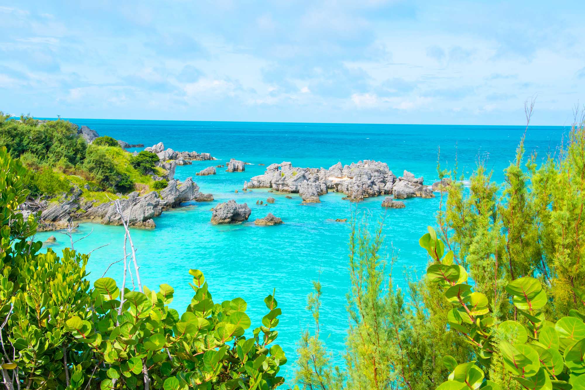 A stunning coastal view of Tobacco Bay in St. George's, Bermuda, featuring crystal-clear turquoise