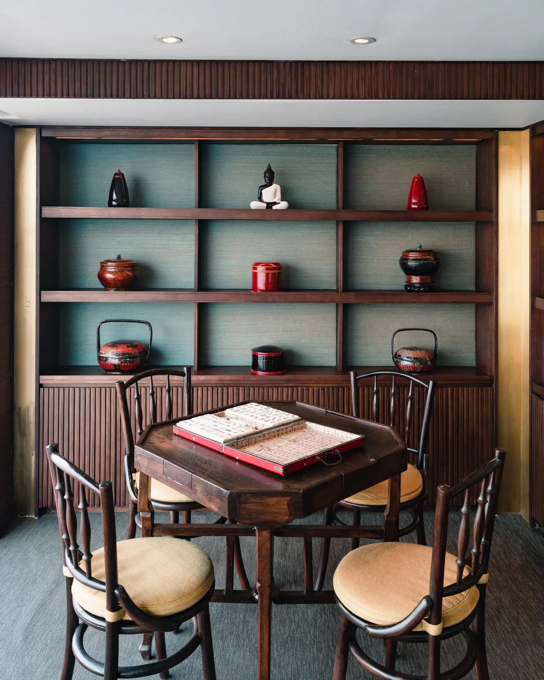 An elegant games room aboard the Aqua Mekong expedition vessel, featuring a wooden table