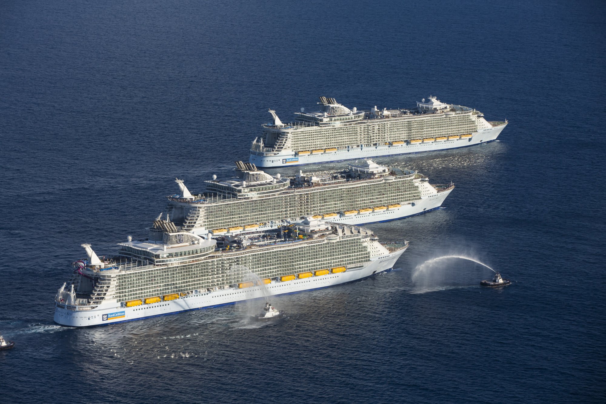 An aerial view of three large cruise ships lined up together offshore Port Everglades, Florida