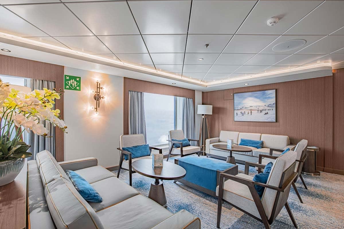 A sophisticated Nordic-themed bar and lounge aboard the Ocean Victory cruise ship, featuring warm