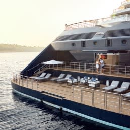 A luxurious superyacht belonging to The Ritz-Carlton Yacht Collection, featuring an expansive