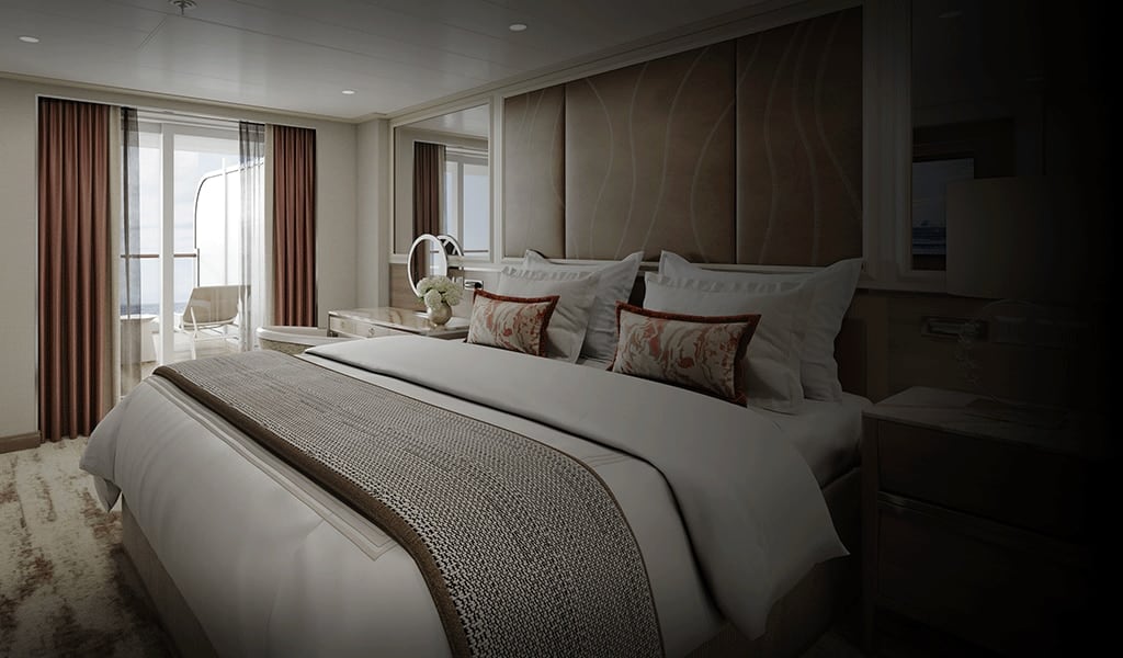 An elegantly appointed master suite featuring a king-size bed with premium linens, decorative throw