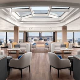 A sophisticated observation lounge aboard The Ritz-Carlton Yacht Collection, featuring
