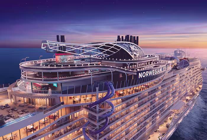 A stunning aerial view of the Norwegian Viva cruise ship illuminated during golden hour, showcasing