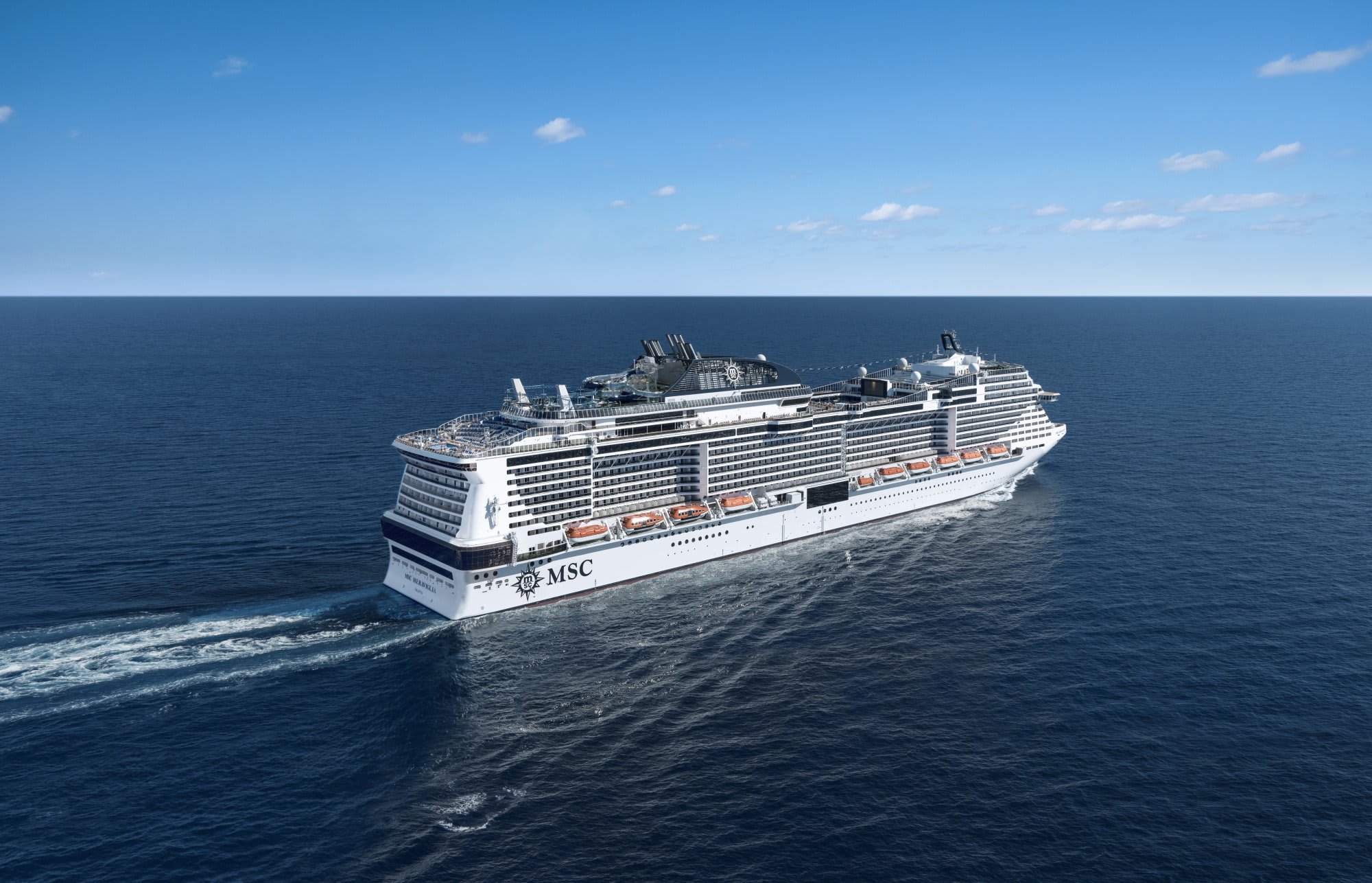 A large modern cruise ship from MSC Cruises sailing on open ocean under clear skies. The vessel