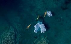 An breathtaking aerial perspective of a pristine tropical island surrounded by crystal-clear
