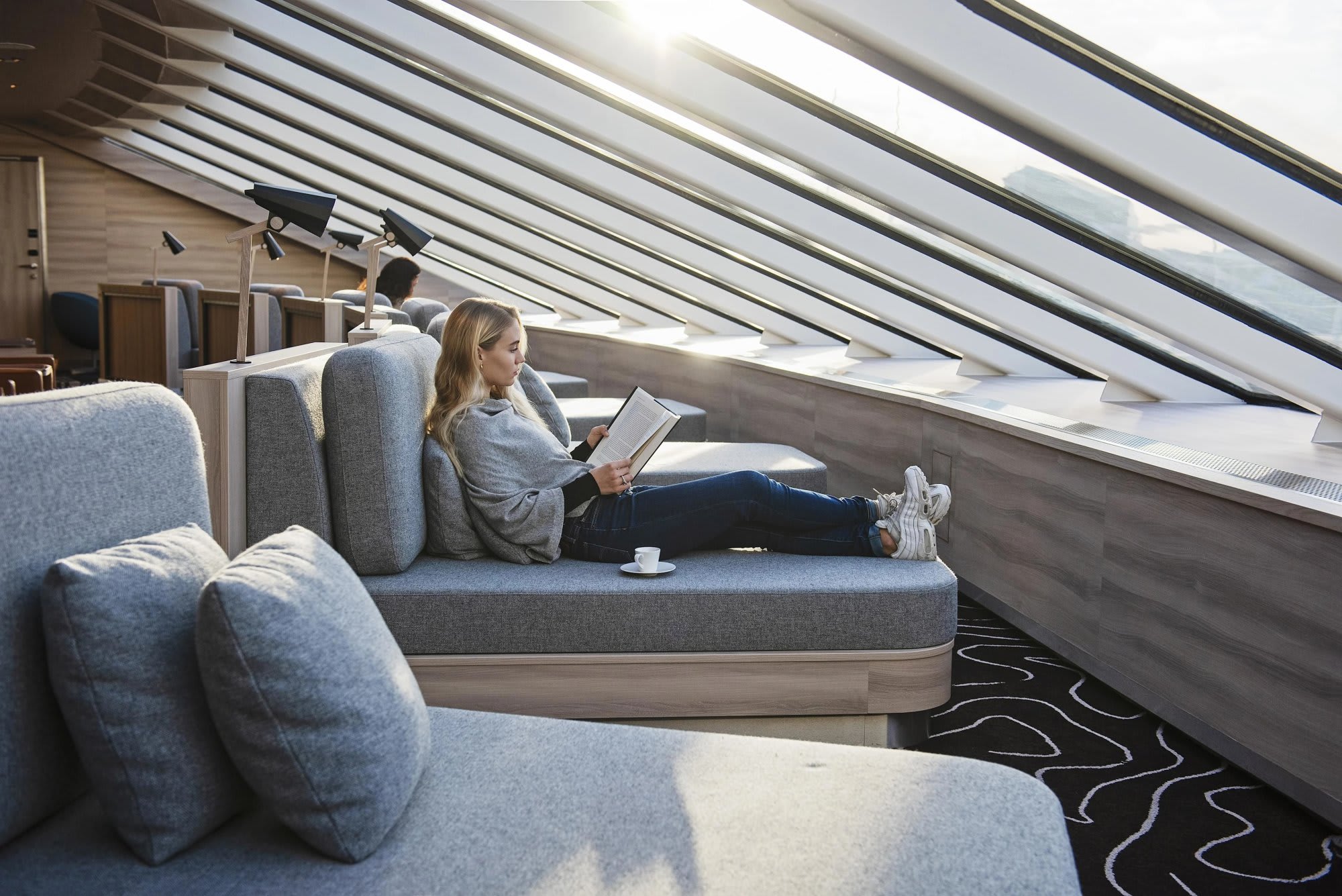 A modern, light-filled lounge aboard the MS Fridtjof Nansen expedition cruise ship, featuring