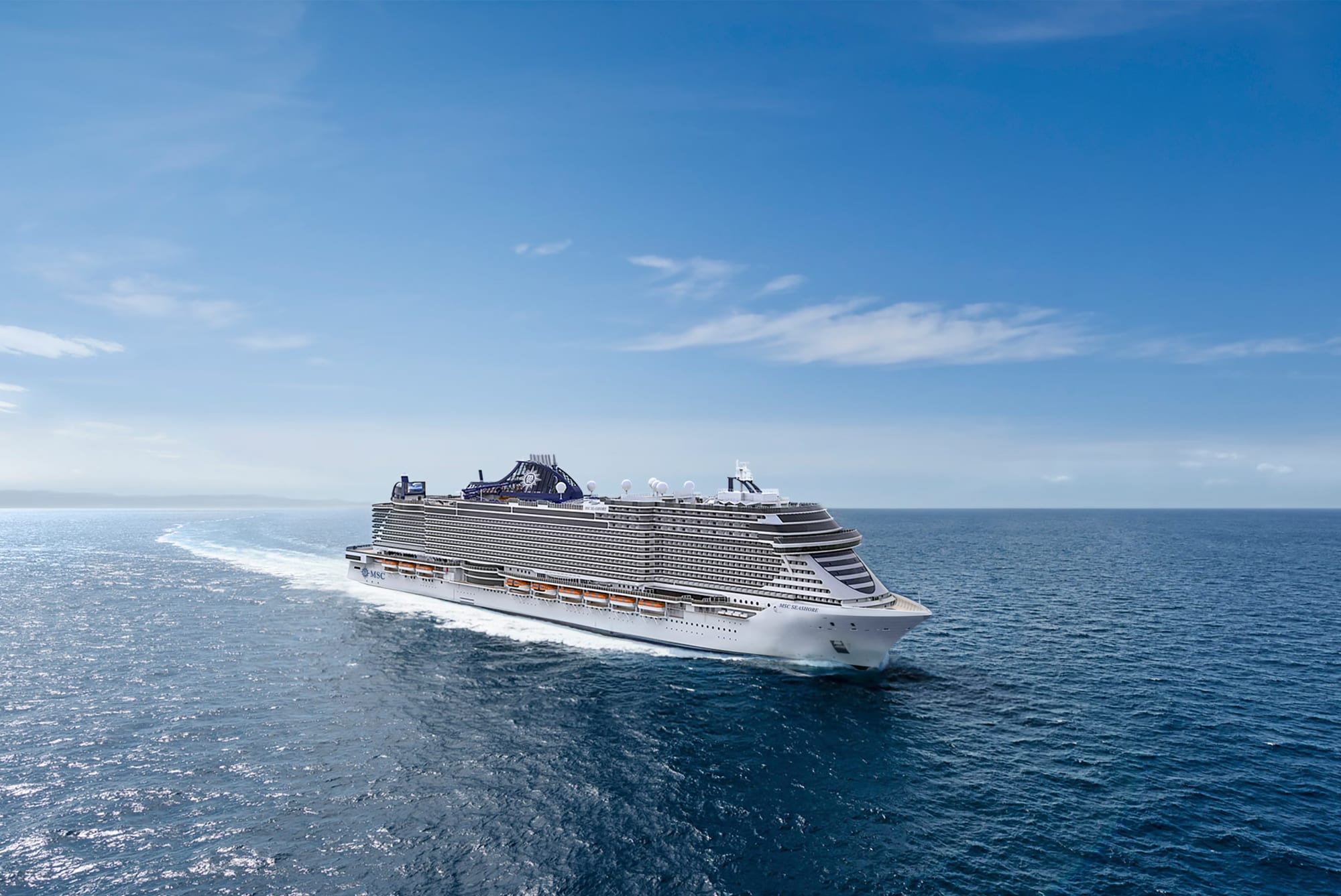 A large modern cruise ship from MSC Cruises sails through calm blue ocean waters under clear skies