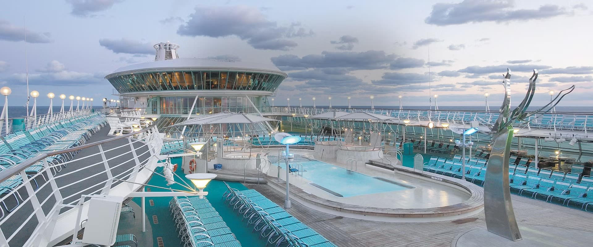 A comprehensive view of the expansive pool deck aboard Royal Caribbean's Vision of the Seas