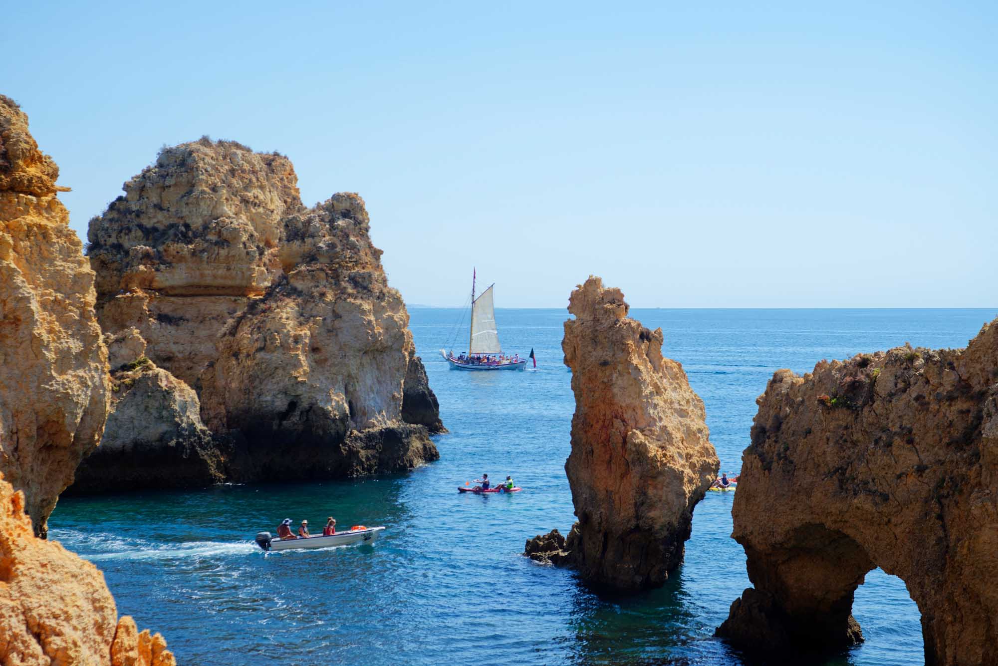 A stunning coastal scene at Ponta da Piedade in Portugal's Algarve region, featuring golden