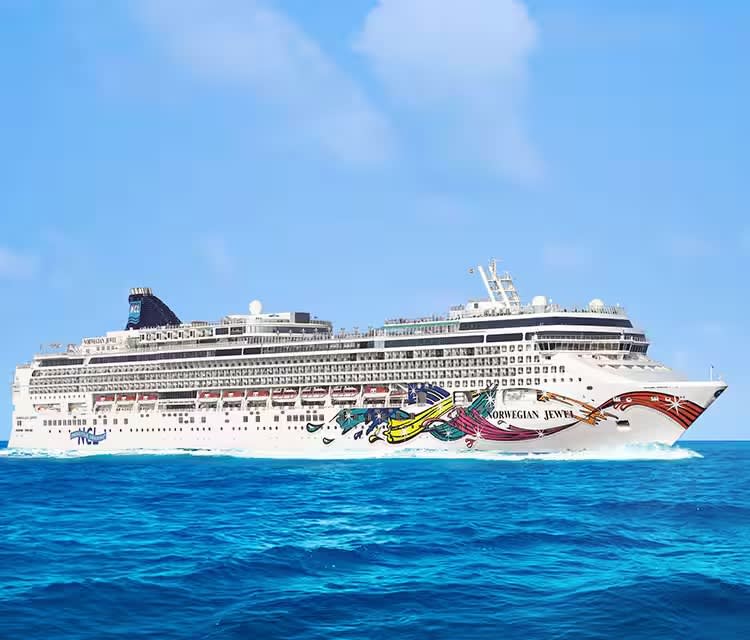 A large modern cruise ship with distinctive colorful hull artwork featuring the Norwegian Cruise