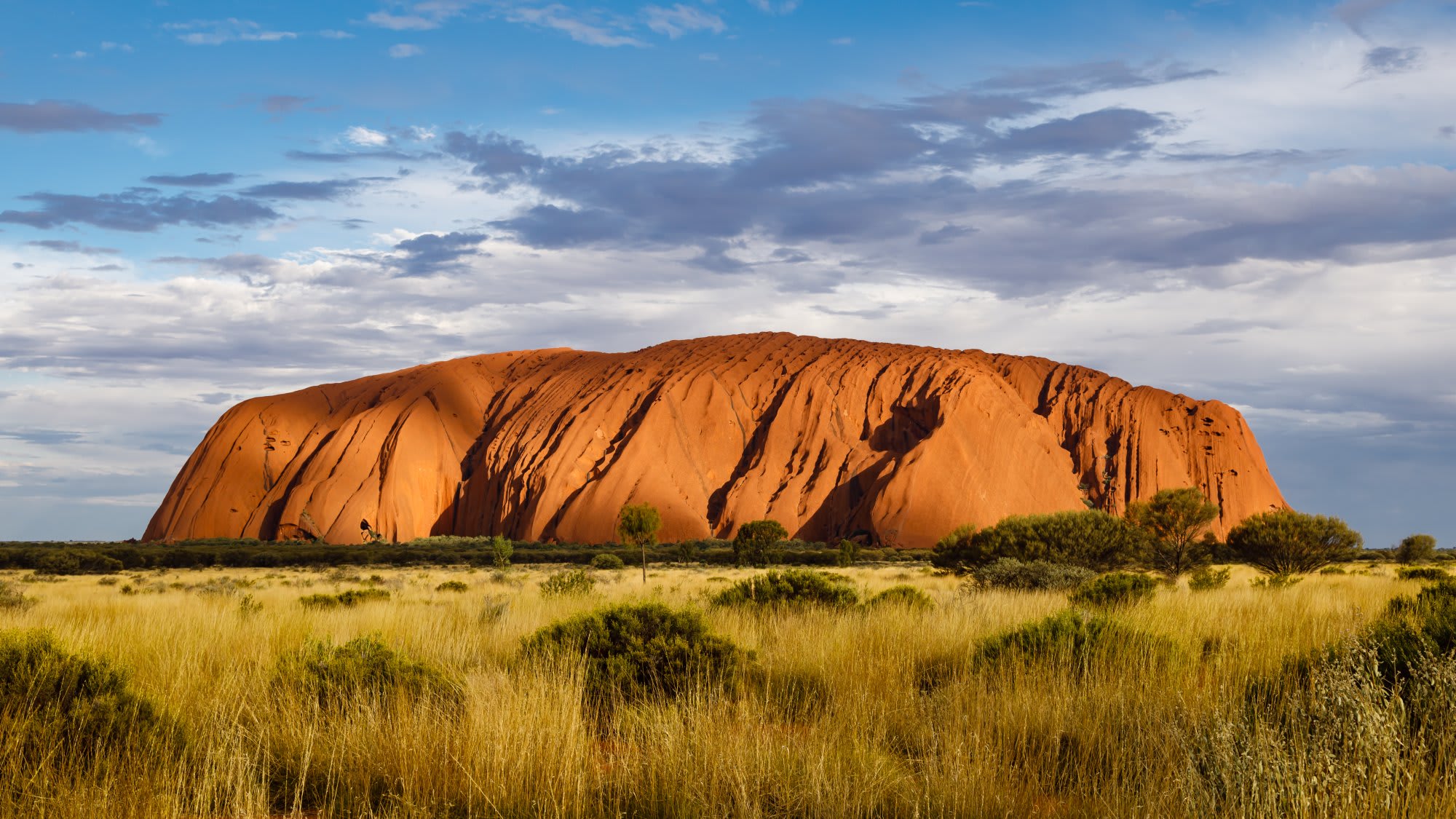 A striking view of Uluru (Ayers Rock), the iconic massive sandstone monolith in central Australia's