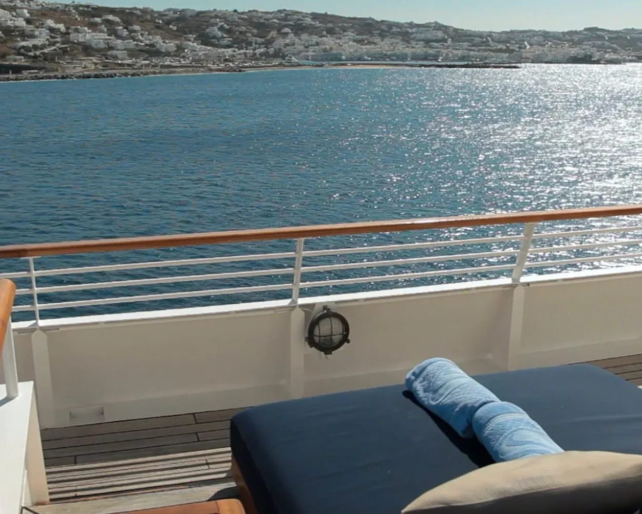 A luxurious cabin balcony or deck area aboard SeaDream Yacht Club, offering panoramic views