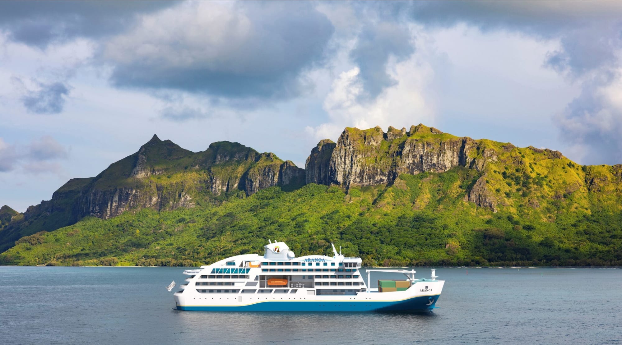 A white and blue cruise ship anchored in turquoise waters near a lush, mountainous tropical island with dramatic green and rocky terrain. The landscape features steep cliffs covered in verdant vegetation under a cloudy blue sky.