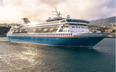 A large contemporary cruise ship with distinctive blue hull and white superstructure is anchored