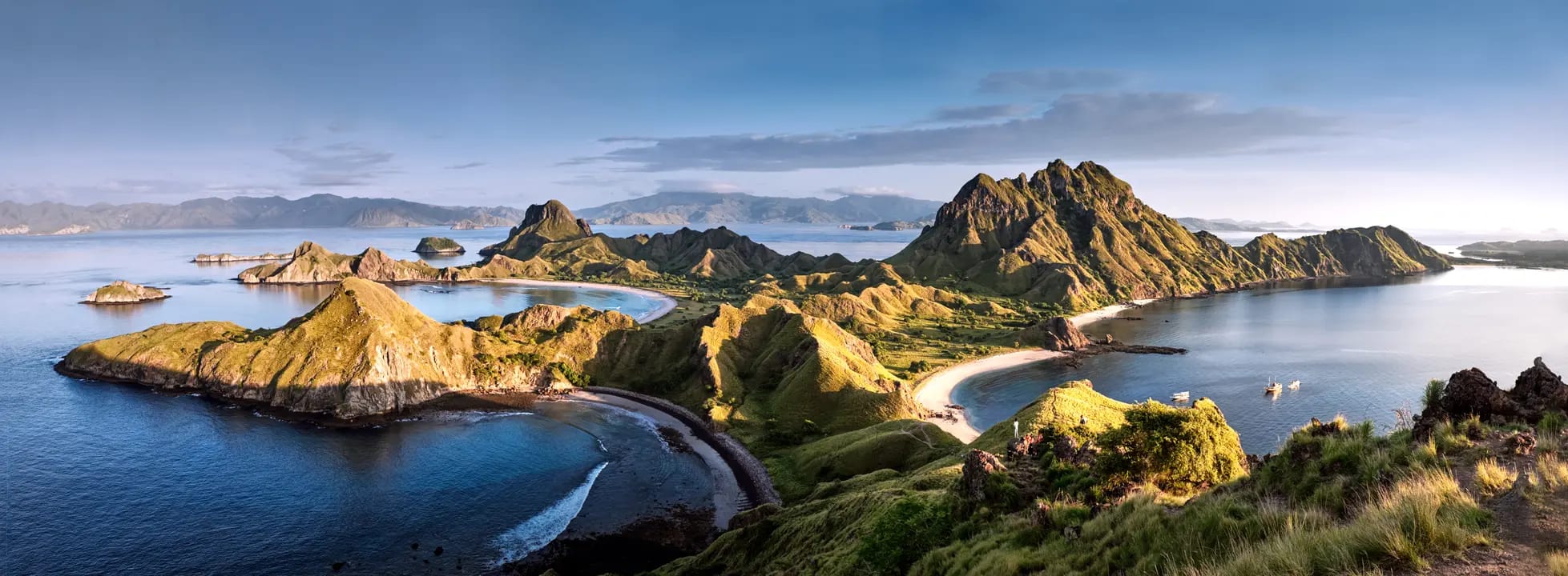 A stunning aerial view of the Komodo Islands in Indonesia, showcasing dramatic volcanic peaks