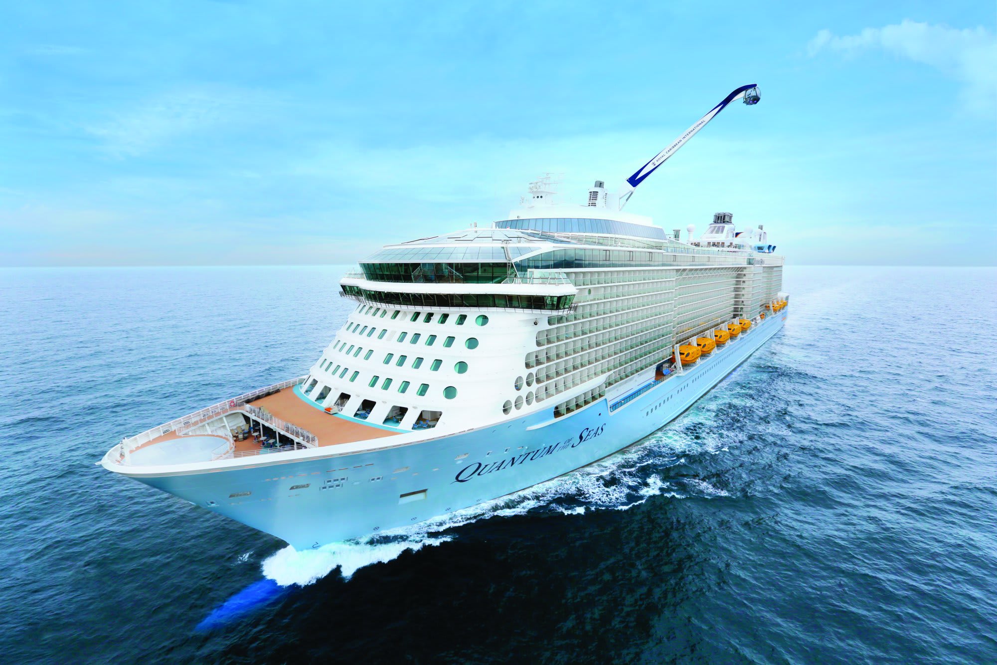 A magnificent aerial view of the Quantum of the Seas cruise ship sailing through calm blue ocean