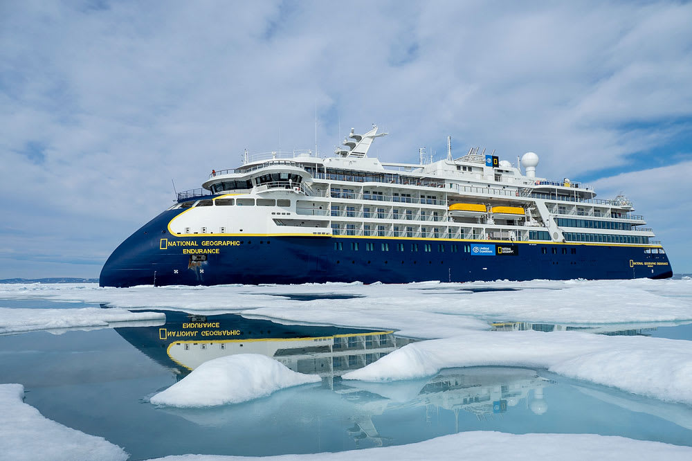 The National Geographic Endurance expedition cruise ship navigates through Arctic sea ice, with its