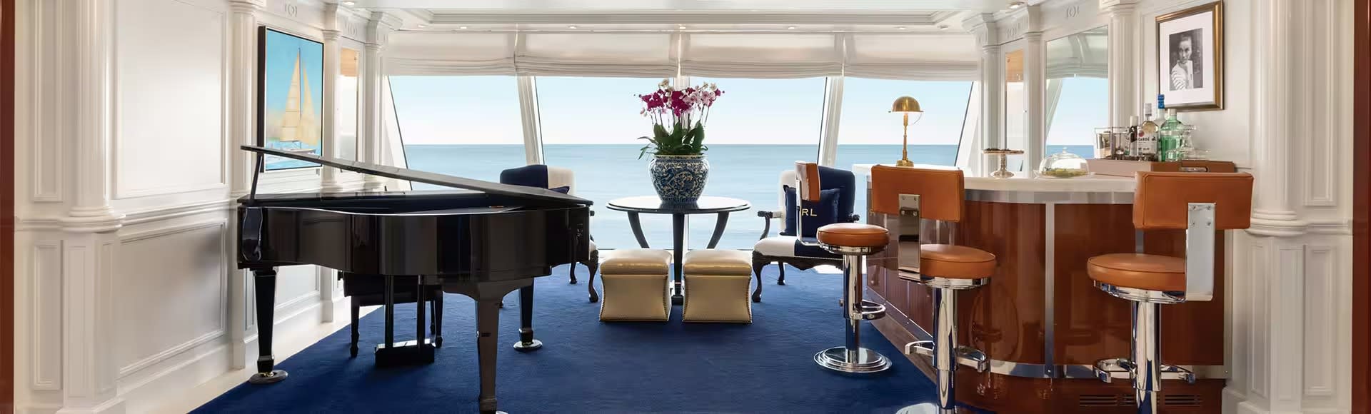 A luxurious owner suite aboard an Oceania Cruises O-Class ship, featuring a grand piano, elegant