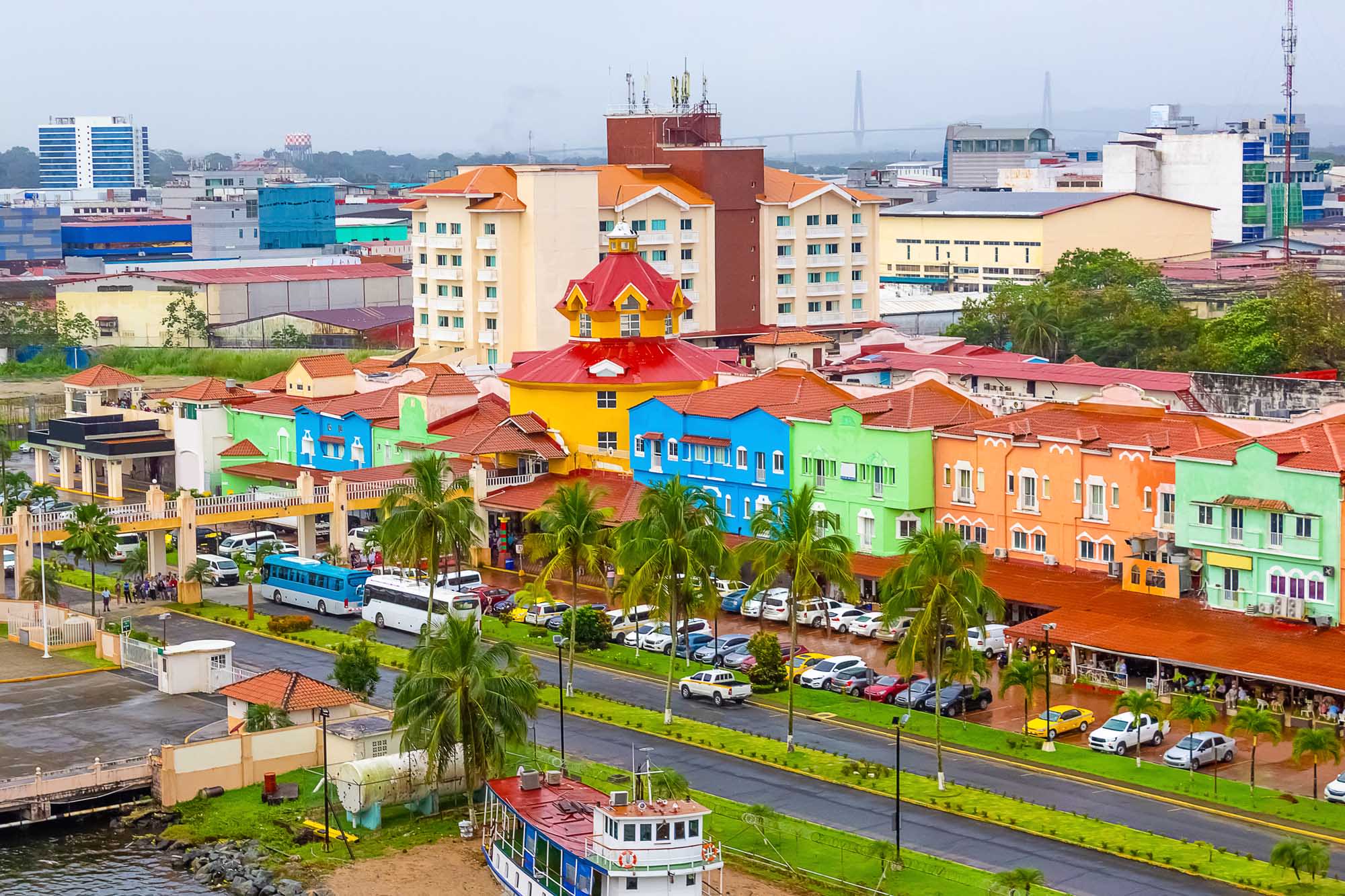 A vibrant aerial view of Colón's distinctive waterfront area featuring brightly colored