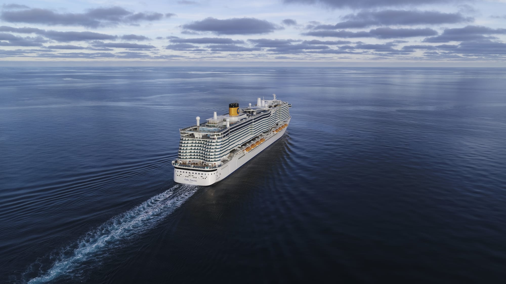 A large modern cruise ship sailing across a serene, expansive ocean under a cloudy sky. The vessel leaves a distinct wake behind it, creating a striking contrast against the smooth, blue water.
