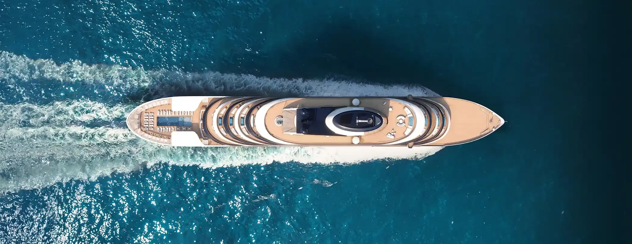 Luxury Cruise Ship Aerial View A stunning overhead view of a pristine luxury cruise ship cutting through deep blue ocean waters