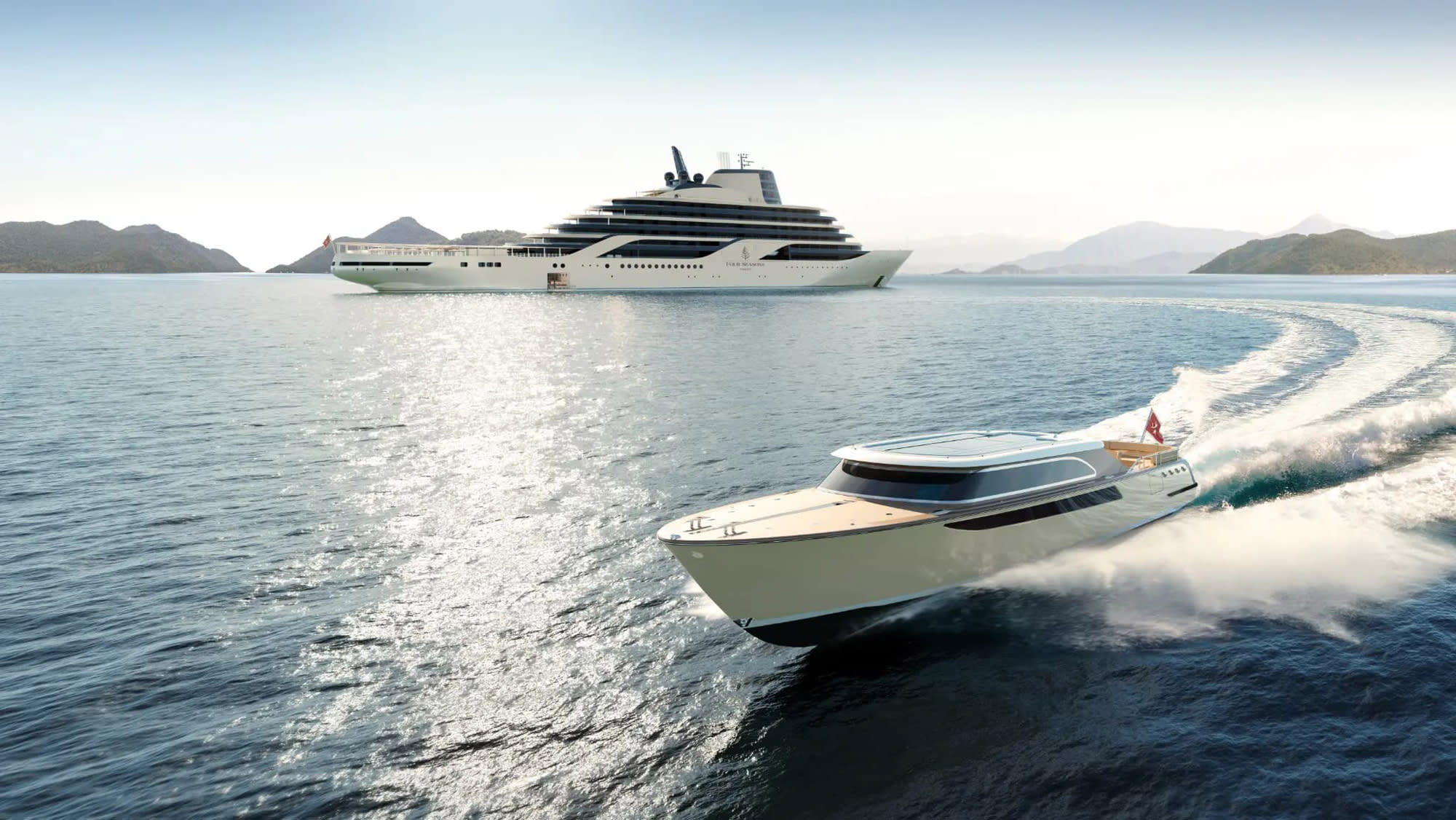 Luxury Yacht and Tender in Scenic Seascape A large white luxury yacht anchored near mountainous islands, with a high-speed tender boat