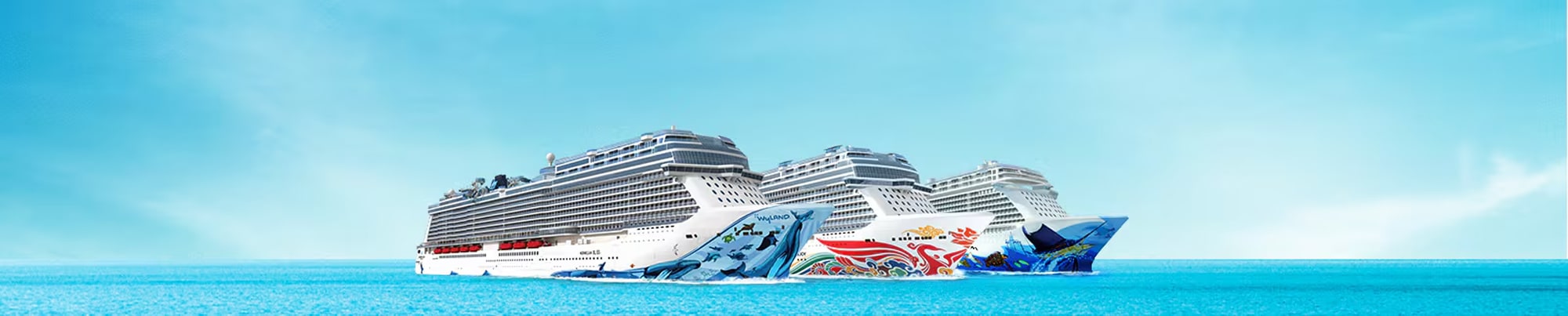 Norwegian Cruise Line Ships at Sea Three modern Norwegian Cruise Line ships sailing on turquoise blue waters, each decorated