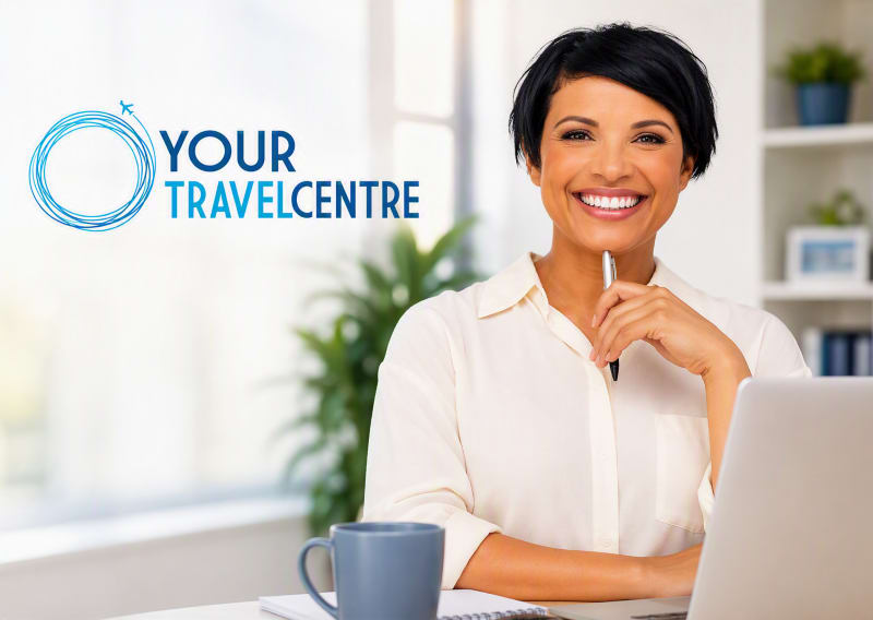 ladysmilingytc A bearded man wearing glasses and a blue button-up shirt sits at a desk working on a laptop in