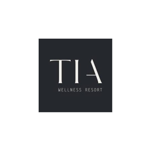 TIA Wellness Resort logo with white text on dark background