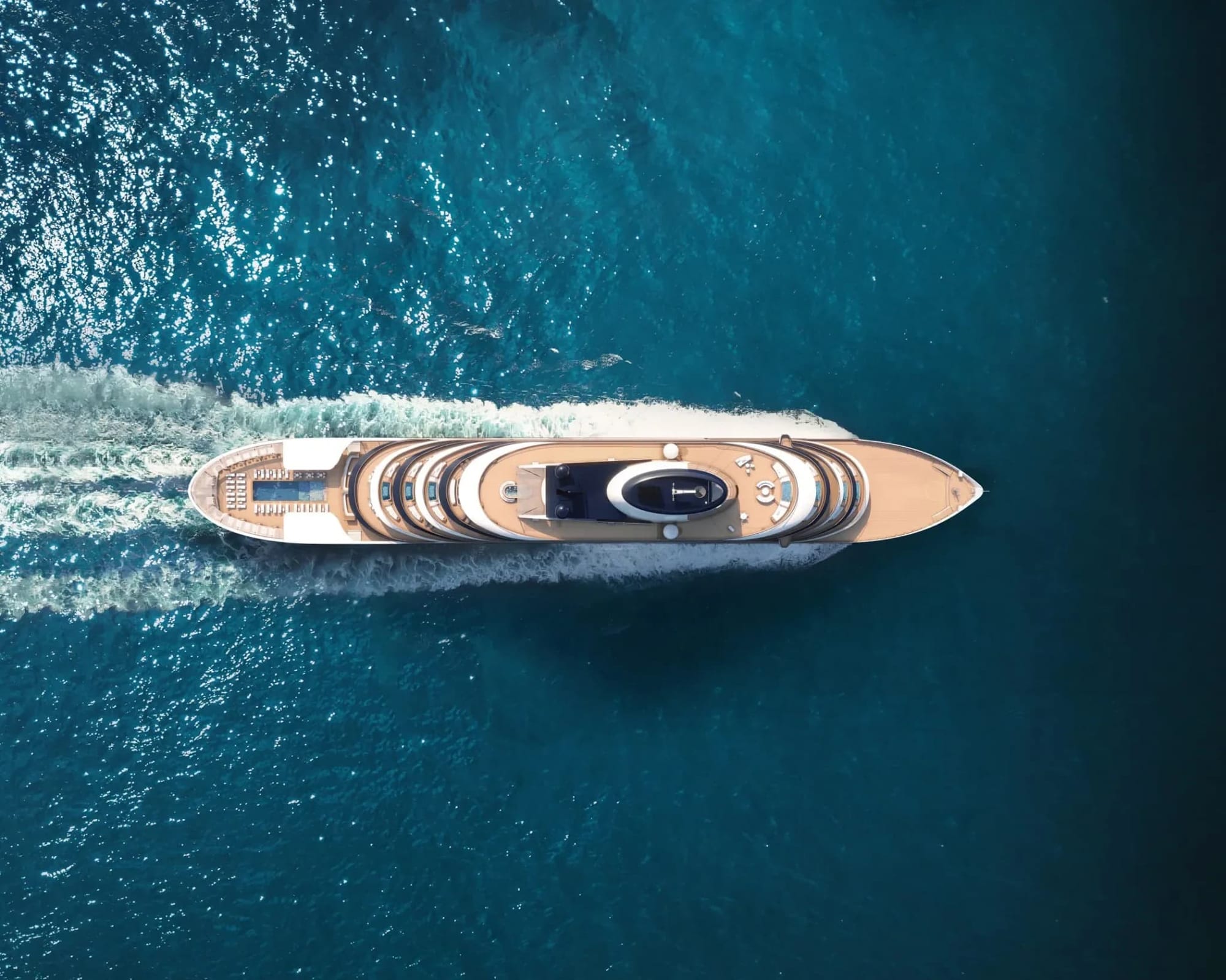 Aerial view of Four Seasons I luxury yacht cruising through azure waters
