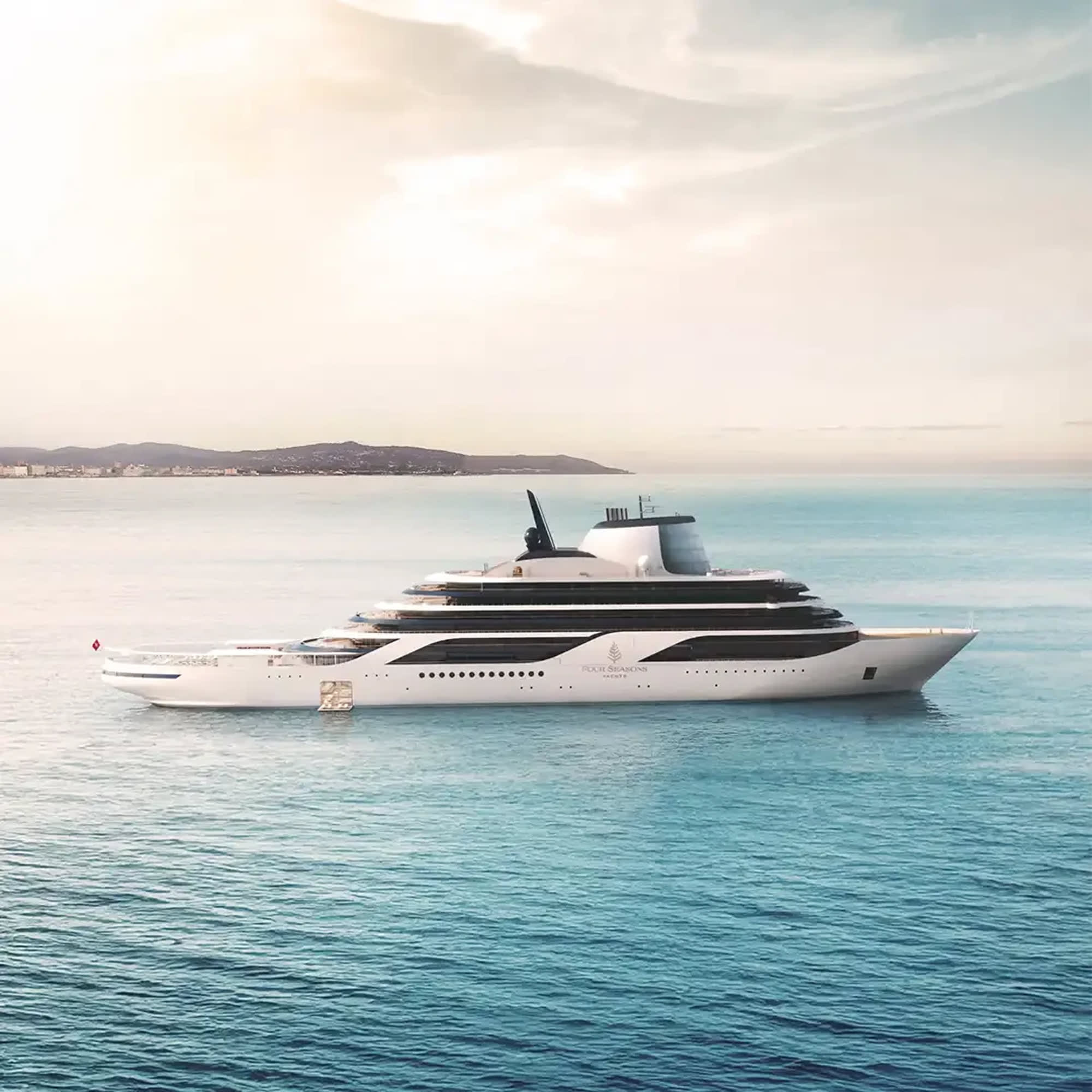 Four Seasons I luxury yacht sailing near a coastal horizon