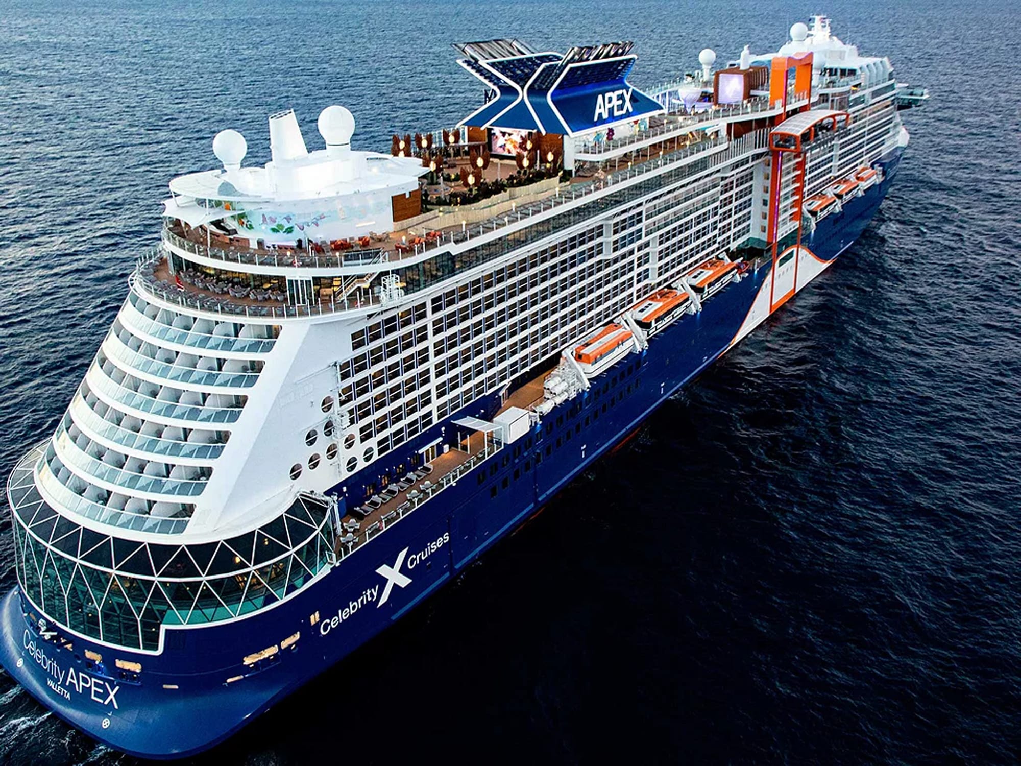 An aerial view of the Celebrity Apex, a modern mega-ship operated by Celebrity Cruises, showcasing