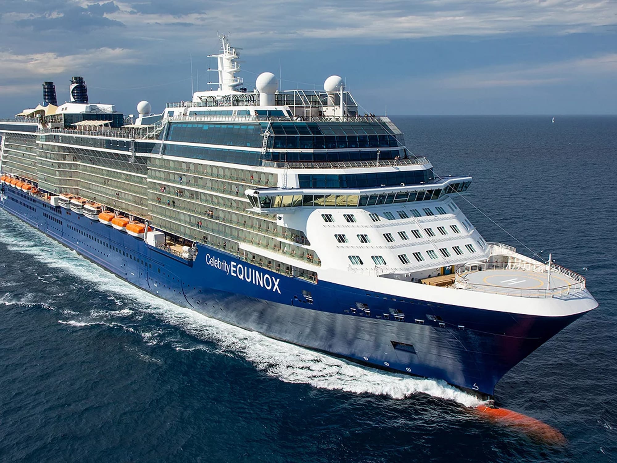 Celebrity Equinox cruise ship at sea with distinctive blue hull and white superstructure