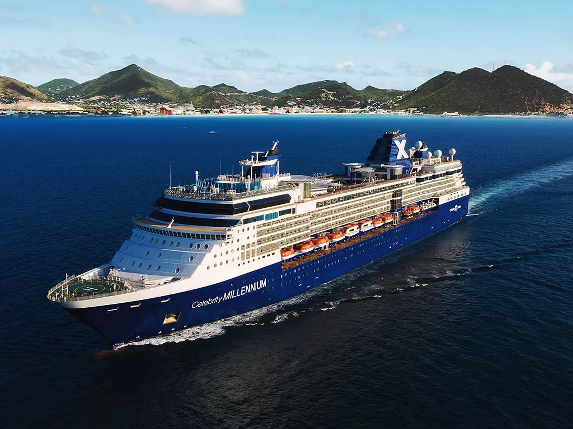 The Celebrity Millennium, a large modern cruise ship with distinctive blue hull and white