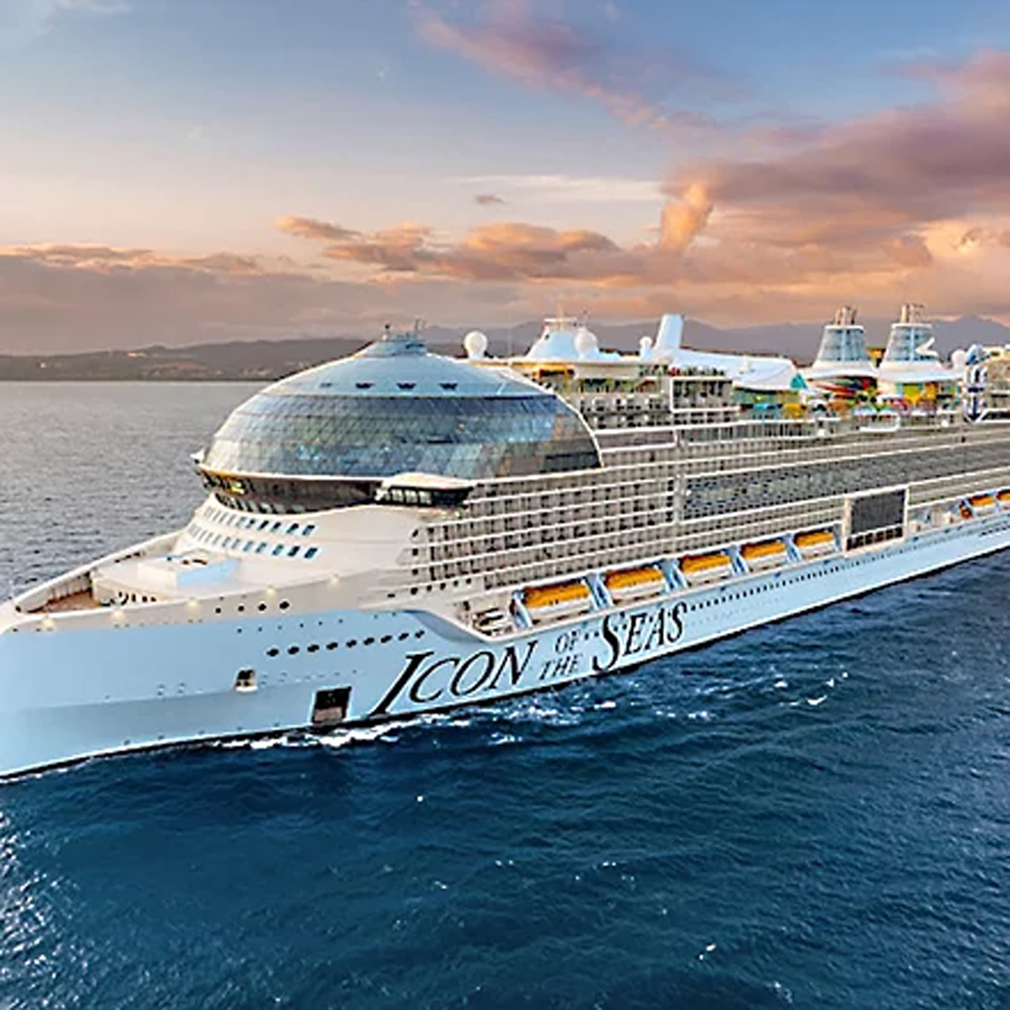 A stunning aerial view of the Icon of the Seas, a massive modern cruise ship, positioned