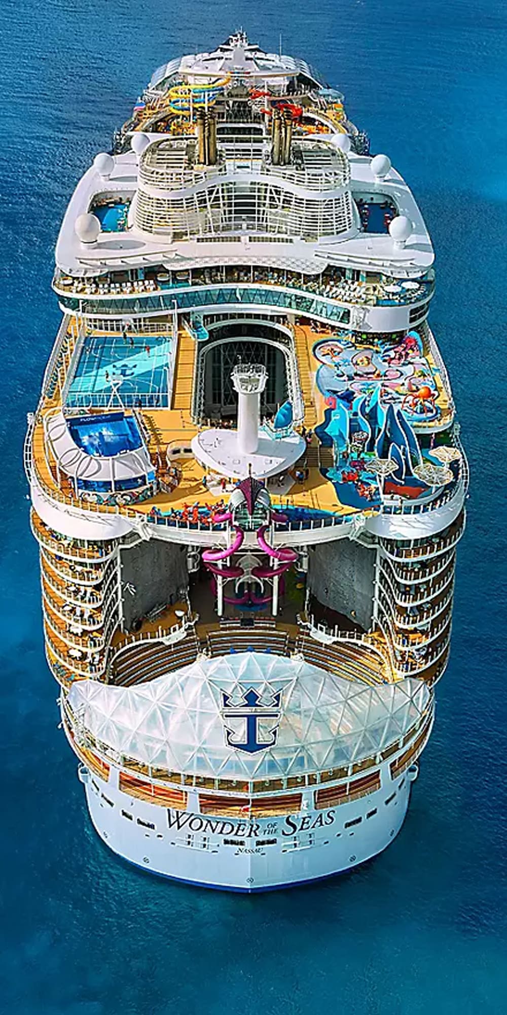 An overhead aerial photograph of the cruise ship Wonder of the Seas, displaying multiple passenger