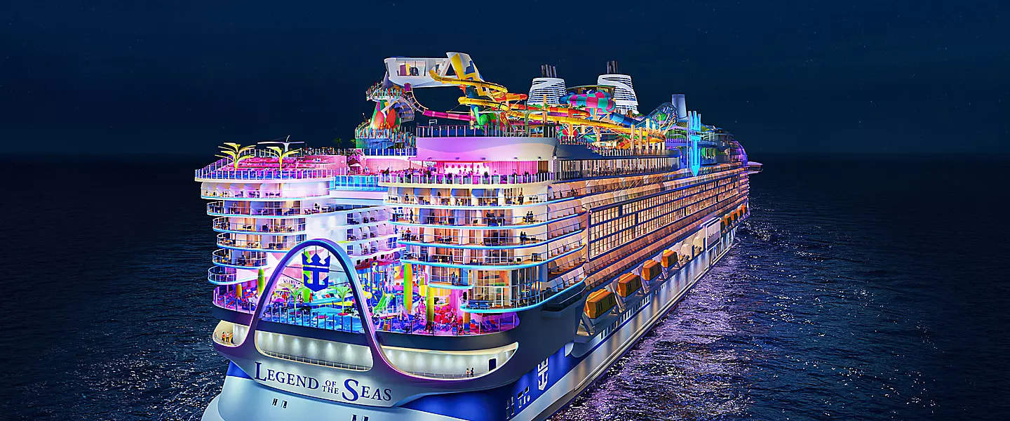 Legend of the Seas lit up at night at sea