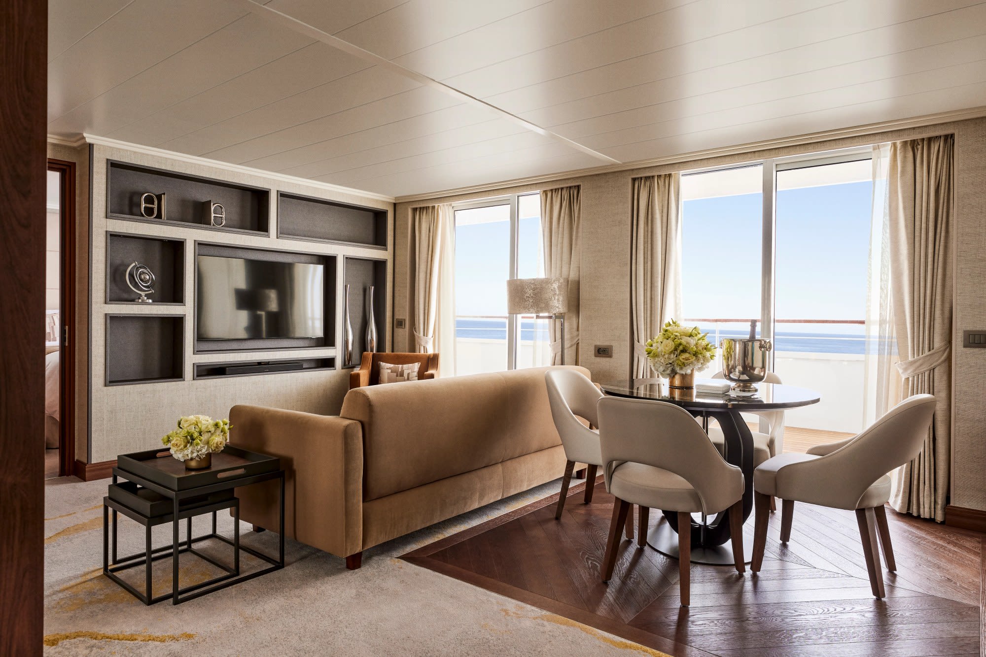 Crystal Serenity Junior Penthouse Suite Living and dining area of a Junior Penthouse Suite on Crystal Serenity