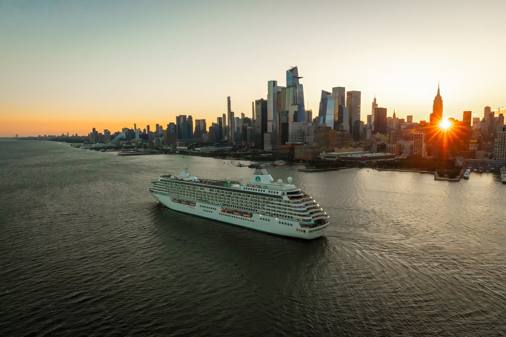 Crystal Serenity Sailing New York Sunset Crystal Serenity sailing past the Manhattan skyline at sunset
