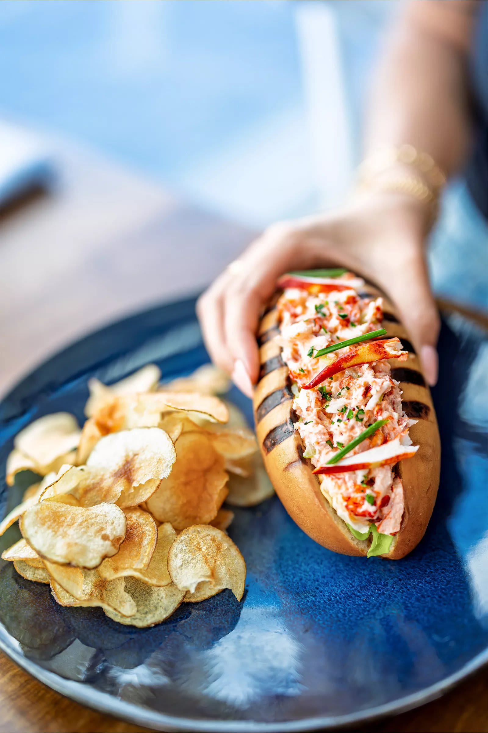 Lobster roll with chips at Hooked Seafood