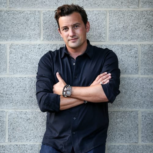 Photo of Will Buxton leaning against a wall
