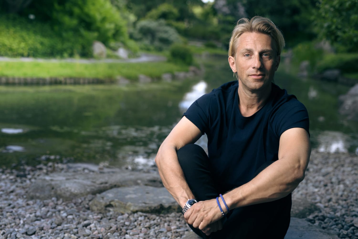 anders hansen sitting in front of water